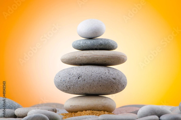 Fototapeta Balanced pebbles with colour background