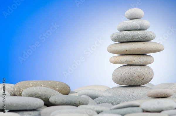 Fototapeta Pebbles stack against gradient background