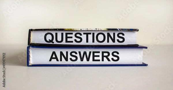 Fototapeta Questions and answers symbol. Concept words 'questions and answers' on books on a beautiful white background. Business and questions and answers concept. Copy space.