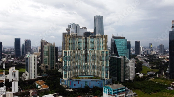 Fototapeta Aerial view of bellagio boutique mall building in Jakarta and noise cloud with cityscape. the largest building center in Jakarta. JAKARTA - Indonesia. February 4, 2021