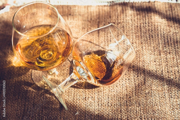 Fototapeta cognac, brandy whiskey bourbock in glasses