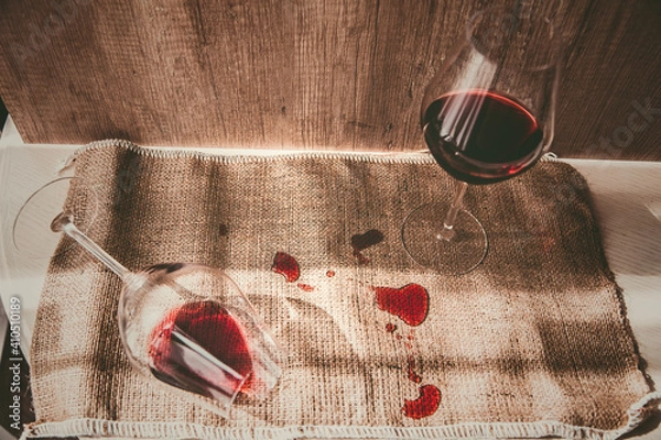 Fototapeta poured red wine on the table, drops of red wine