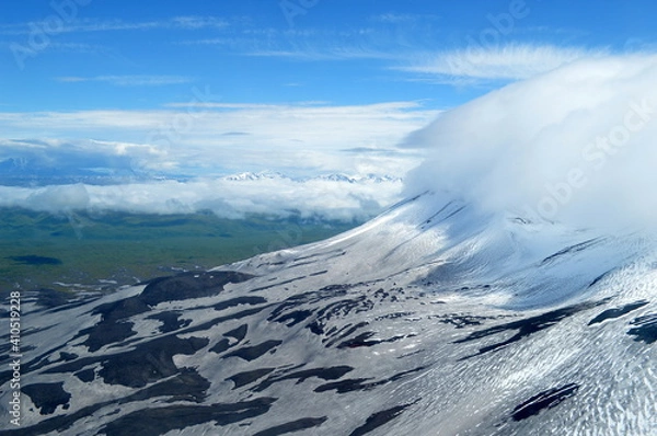 Fototapeta Snowcapped mountains seen from the helicopter on the way to the Valley of Geysers, Kamchatka peninsula, Russia.