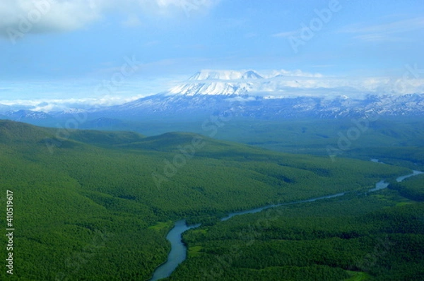 Fototapeta Snowcapped mountains seen from the helicopter on the way to the Valley of Geysers, Kamchatka peninsula, Russia.