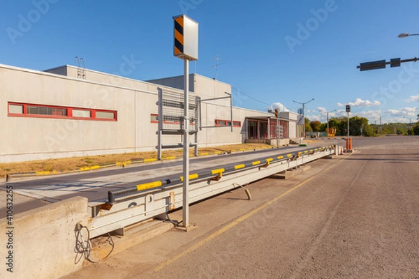 Fototapeta Cargo weighing service by truck scales