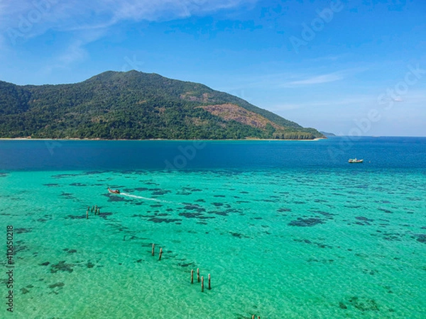 Fototapeta The aerial view of Koh Lipe island, Thailand. The paradise turquoise beach with the big mountain behind. 