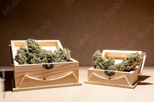 Obraz Ready-to-use medical marihuana buds inside two wooden boxes. Selective focus.