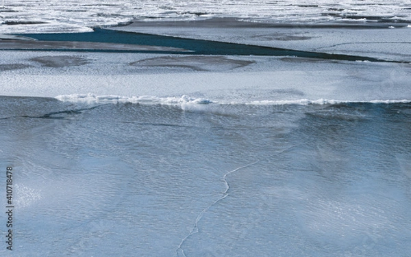 Obraz Beautiful abstract ice patterns in frozen stream
