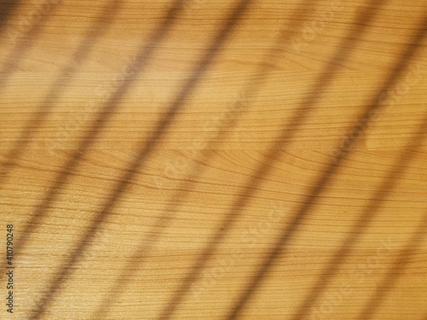 Obraz Texture of wooden table background with blurred striped light.