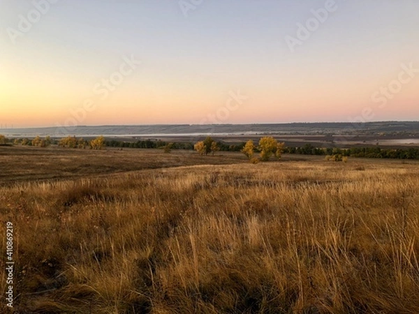 Fototapeta sunset over the field