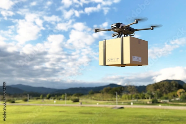 Fototapeta Delivery drone flying in the mountain