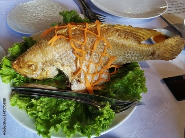 Obraz Close up of cooked fished with fine decoration