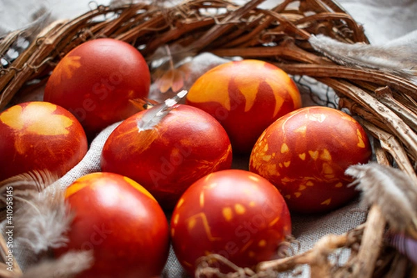 Obraz Easter Eggs Decorated with Natural Fresh Leaves and Boiled in Onions Peels on gray linen tablecloth. Happy Easter concept. Eco Easter eggs.  Zero waste Easter.