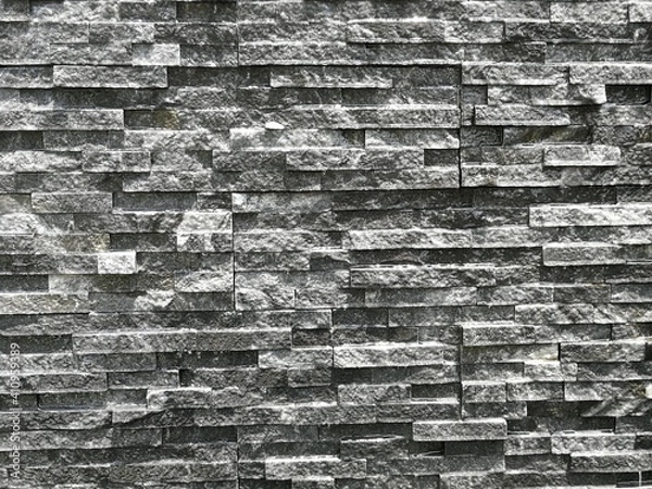 Fototapeta Background of small grey and greyish bricks