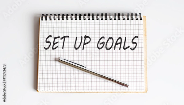 Fototapeta Notebook with pen and Notes about SET UP GOALS