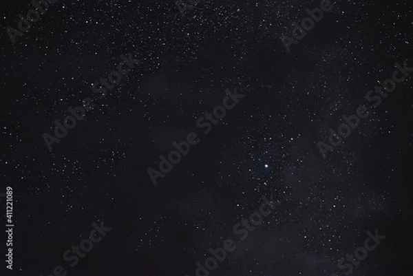 Obraz Stars in the night sky through the clouds on a summer night