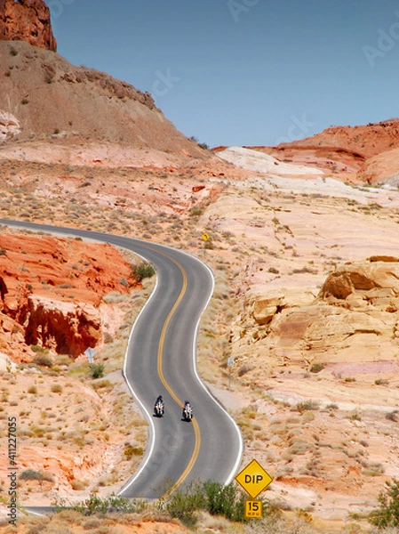 Fototapeta motorcycle riding in Valley of fire State Parkt on empty highway in scenic landscape