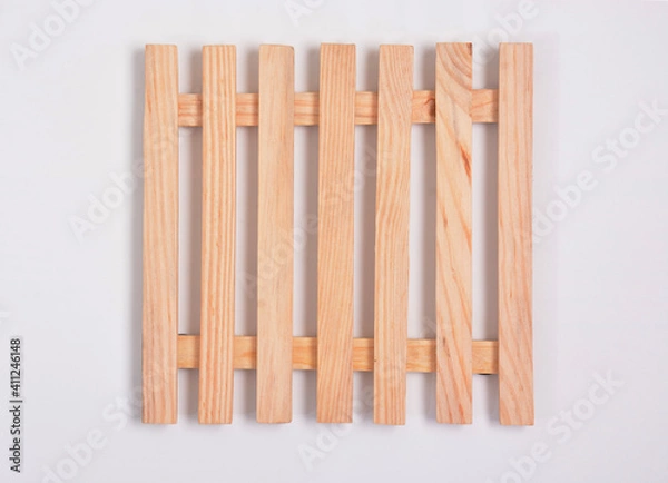 Fototapeta High angle view of mini wood pallet in the middle of white background