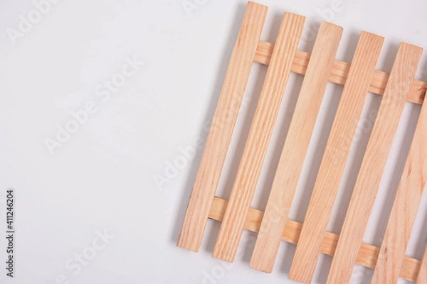 Fototapeta High angle view of mini wood pallet on white background