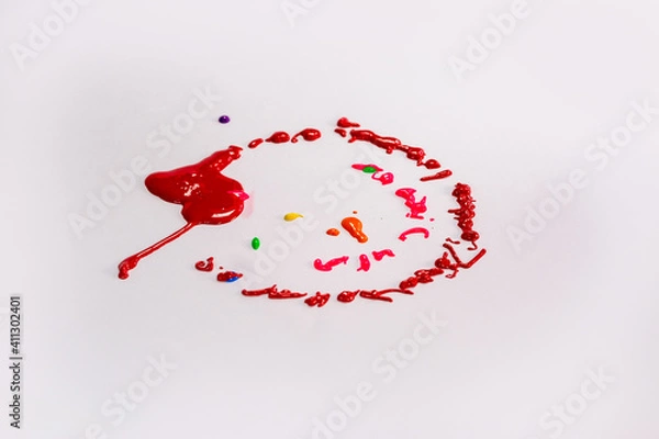 Fototapeta .Colors drop onto a spinning white background. The color of the drops is a circular halo