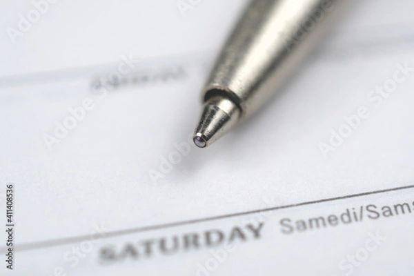 Obraz Pen and diary. Close up of a pen on a notebook with depth of field.