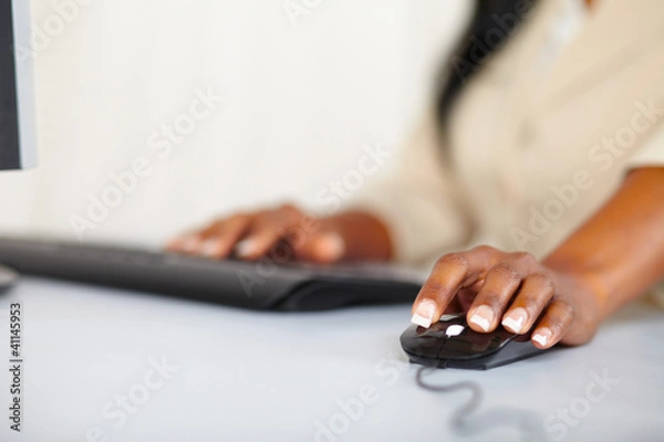 Fototapeta Young woman hands working on computer