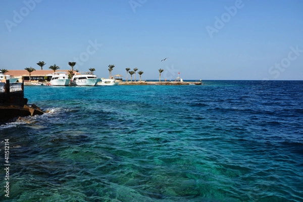 Fototapeta Turquoise sea, white yachts and beach in the background
