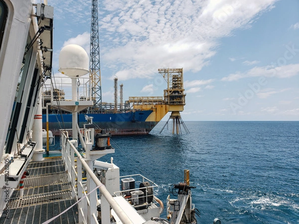Fototapeta Floating production storage and offloading (FPSO) vessel, oil and gas indutry. View from ship