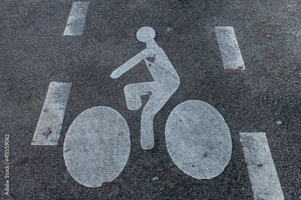 Fototapeta white bicycle markings on grey asphalt
