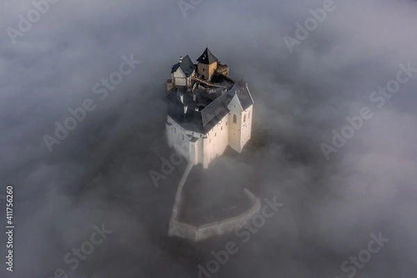 Fototapeta Fuzer, Hungary - Aerial view of the beautiful Castle of Fuzer standing out of the fog on an autumn morning. This castle has been located in the Zemplen Mountains