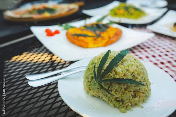 Fototapeta rice a mixture ofcannabis leaves, developed for health lovers in a new, licensed and legal form. Guaranteed safety, help relieve anxiety, reduce sadness. Concept Cannabis for health.