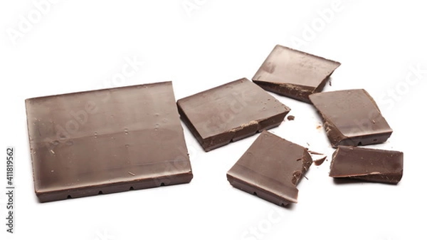 Fototapeta Chocolate bar pieces pile isolated on white background