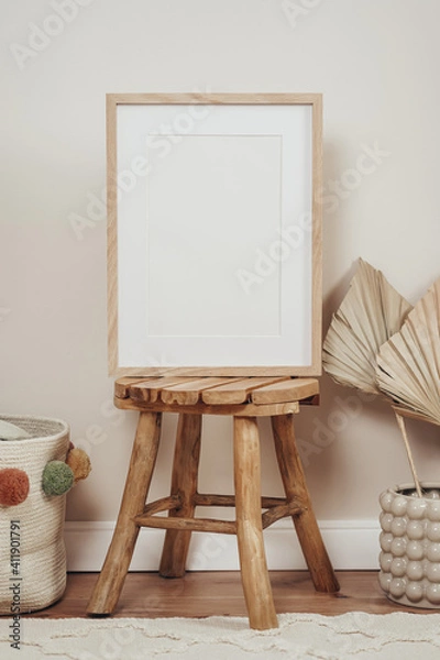 Fototapeta Wooden frames and canvases in children's boho interior 