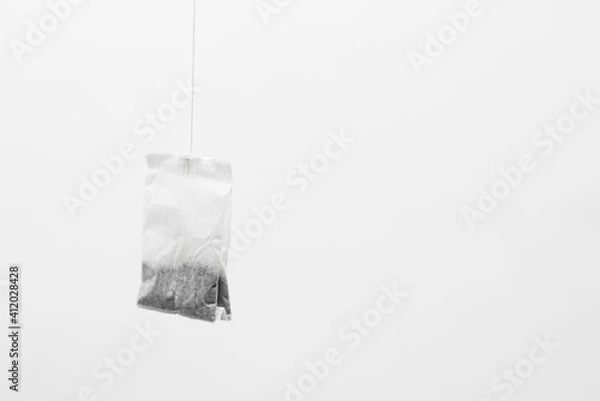 Fototapeta Tea bag on gray background.