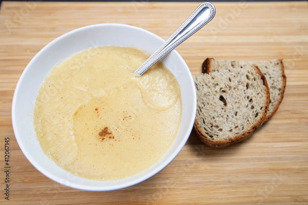 Obraz A Bowl of Cornmeal Porridge with spoon, View from above.