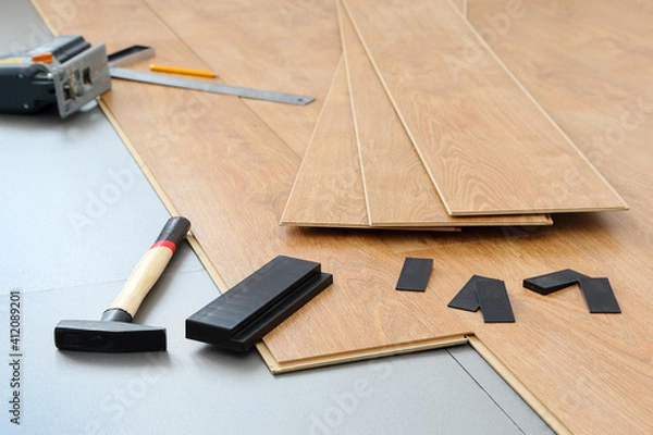 Obraz Laminate on a gray base and accessories for its installation