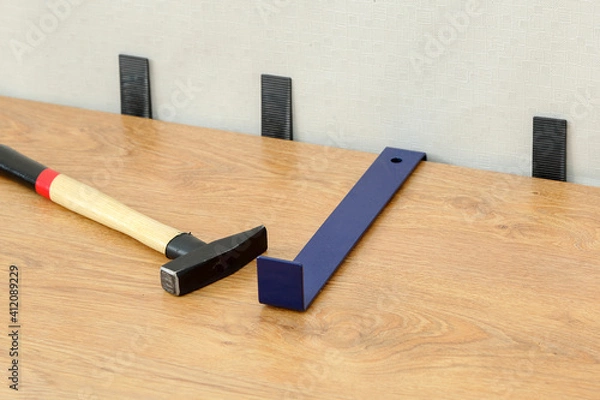 Obraz Laminate on a gray base and accessories for its installation