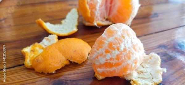 Obraz Fresh oranges, yellow fruit on the surface of a wooden table, ready to eat.
