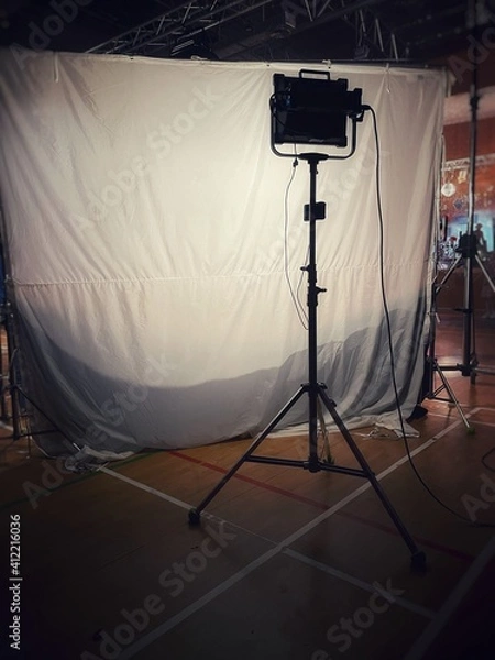Obraz Behind the scenes of music video shooting production crew team silhouette and camera equipment in studio.