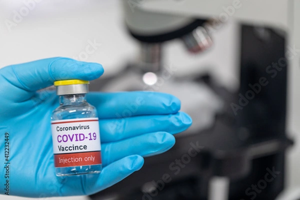 Fototapeta Background of Development and creation of a coronavirus vaccine COVID-19 in the Laboratory.(Covid-19 vaccine in the laboratory)