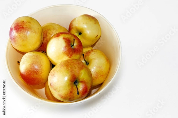 Obraz apples in a fruit basket isolated on white