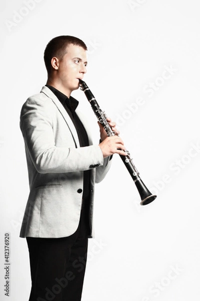 Fototapeta Clarinet player classical musician isolated