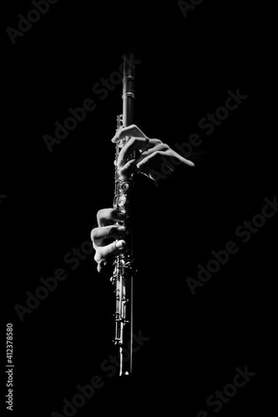 Fototapeta Flute instrument. Flutist hands playing flute music