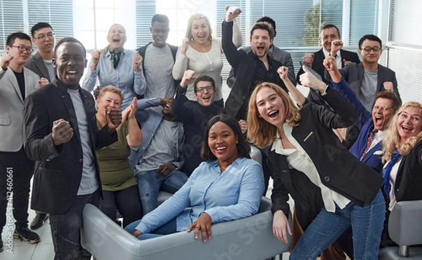 Obraz happy team of diverse corporate employees in the office lobby.