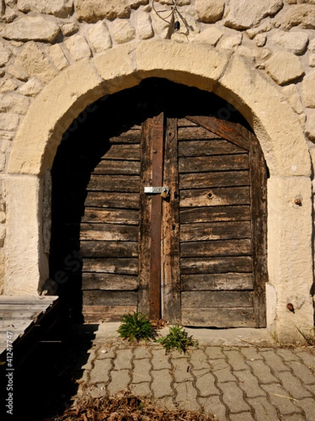 Obraz closed wooden door of a wine cellar