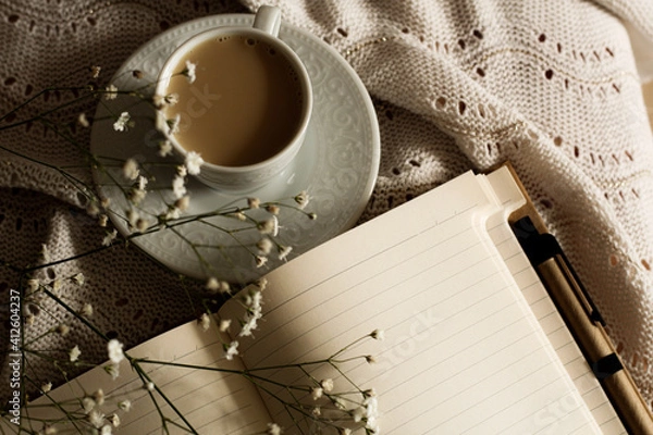 Obraz Hygge life style concept: cup of coffee and note book