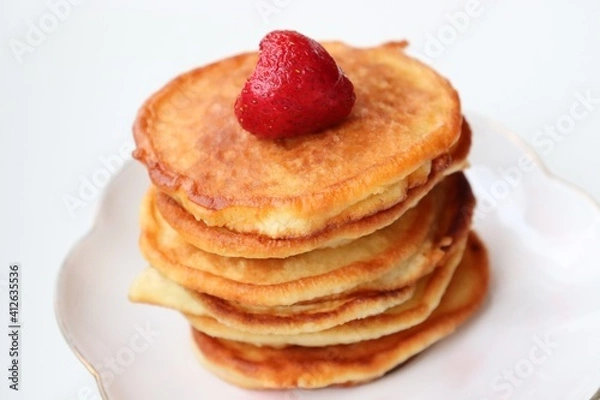 Fototapeta Sweet pancakes for breakfast with berries