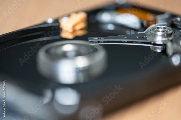 Fototapeta Close up photo of the read and write head of a hard drive while it is working 