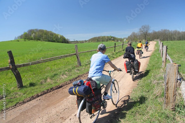 Fototapeta Cyclists in a countryside