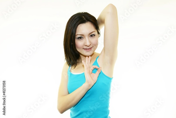 Fototapeta エストぉしている笑顔の女性